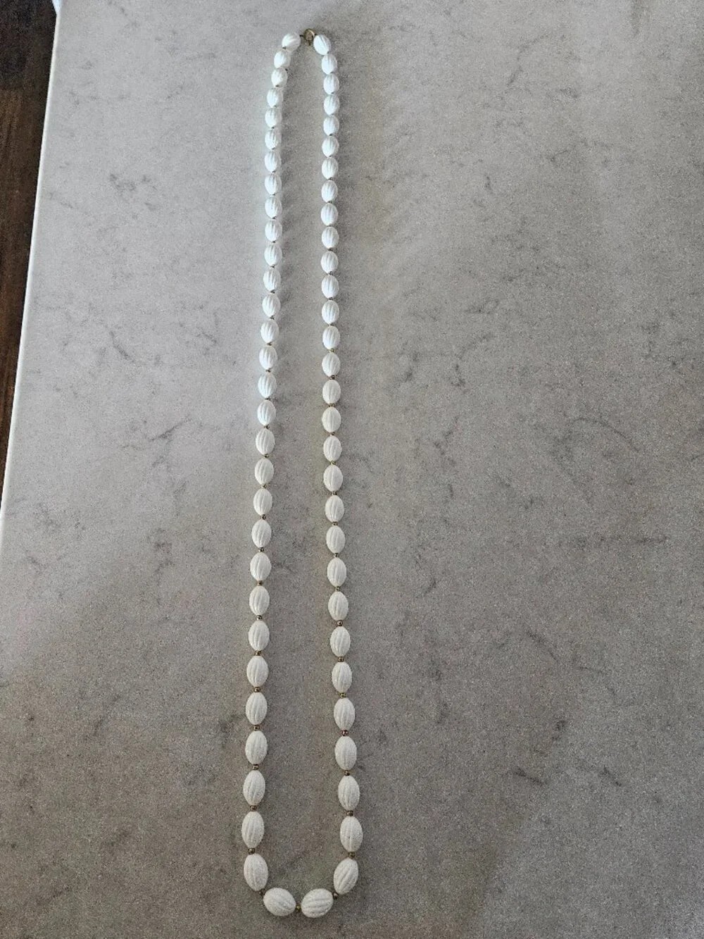 RARE AND VINTAGE WHITE RIBBED OVAL BEAD 48